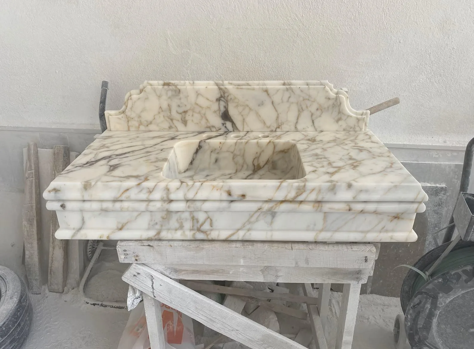 Calacatta Viola marble floating bathroom sink with integrated basin and backsplash, luxury marble sink