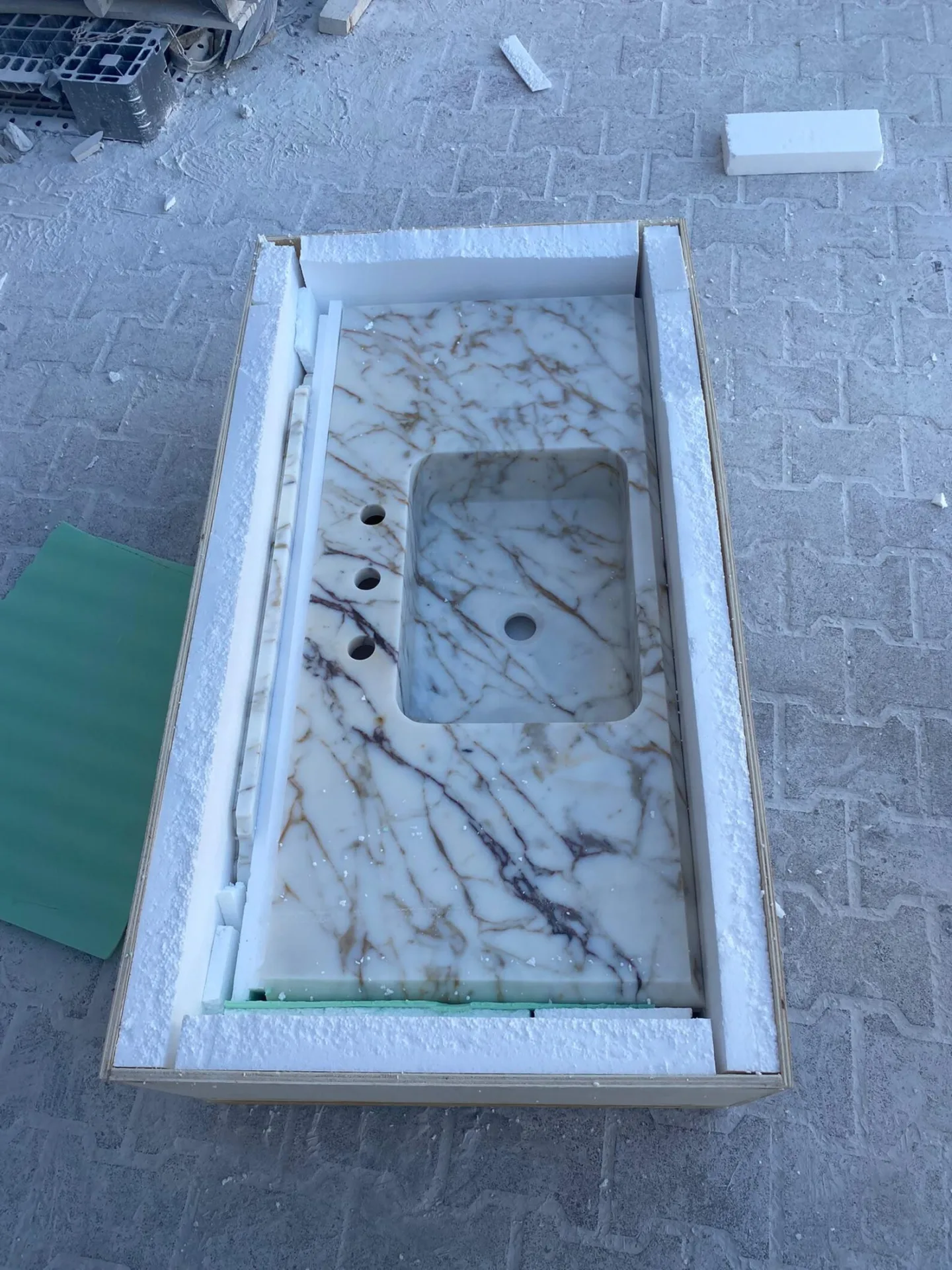 Calacatta Viola marble floating bathroom sink with integrated basin and backsplash, luxury marble sink